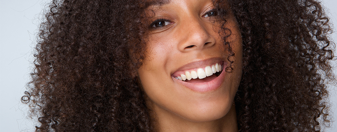 happy-african-american-woman-with-curly-hair-PR47SHE happy-african-american-woman-with-curly-hair-PR47SHE